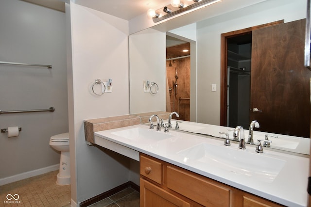 bathroom with walk in shower, vanity, toilet, and tile patterned flooring