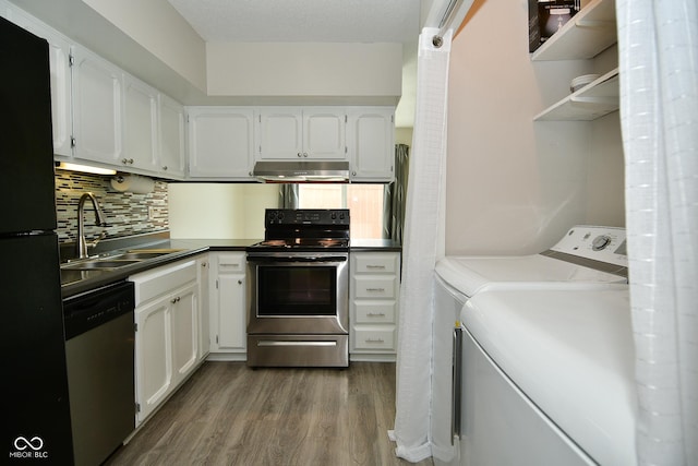 kitchen featuring sink, washing machine and dryer, white cabinets, and appliances with stainless steel finishes