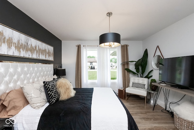 bedroom with wood-type flooring