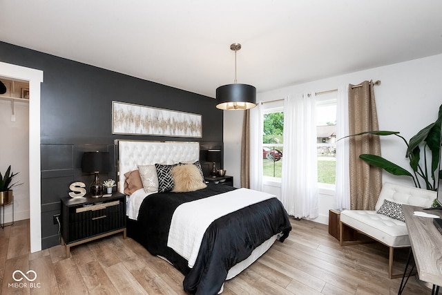 bedroom with light hardwood / wood-style floors