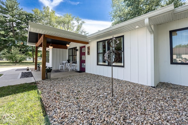 exterior space featuring a porch and board and batten siding