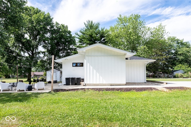 view of outbuilding featuring a yard