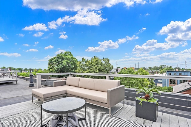 wooden terrace featuring outdoor lounge area