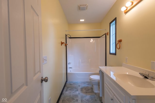 full bath featuring toilet, vanity, visible vents, baseboards, and washtub / shower combination