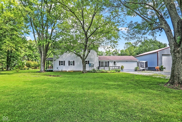 exterior space with an outbuilding and a garage