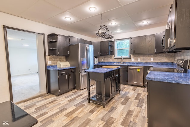 kitchen featuring light wood finished floors, open shelves, stainless steel appliances, dark countertops, and backsplash