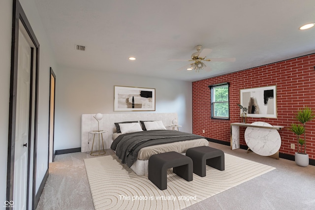 bedroom featuring brick wall, visible vents, and carpet flooring