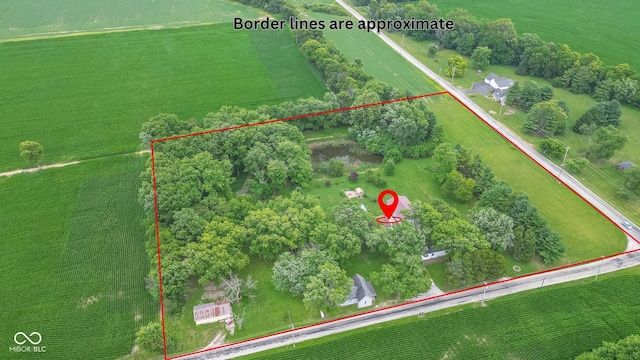 birds eye view of property featuring a rural view