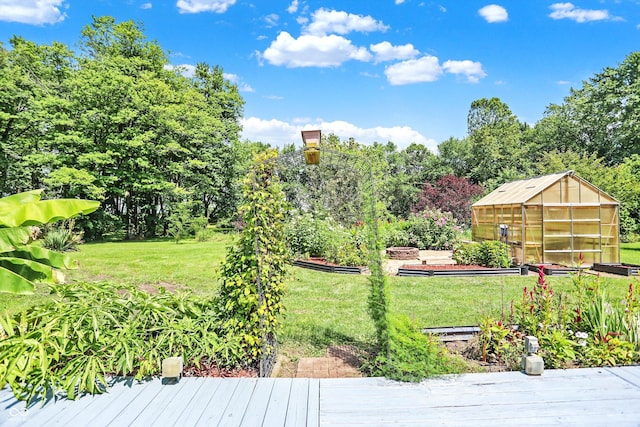 view of yard featuring an outbuilding and an exterior structure