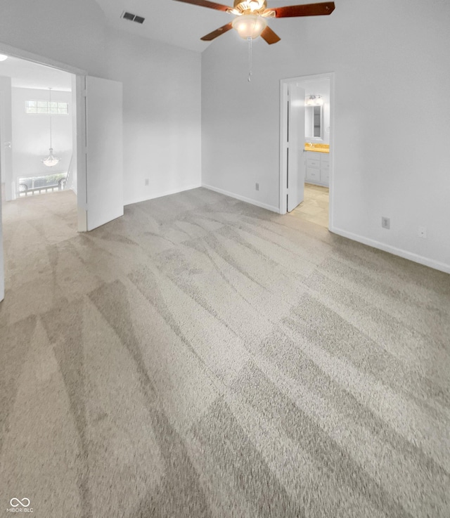 carpeted empty room featuring ceiling fan