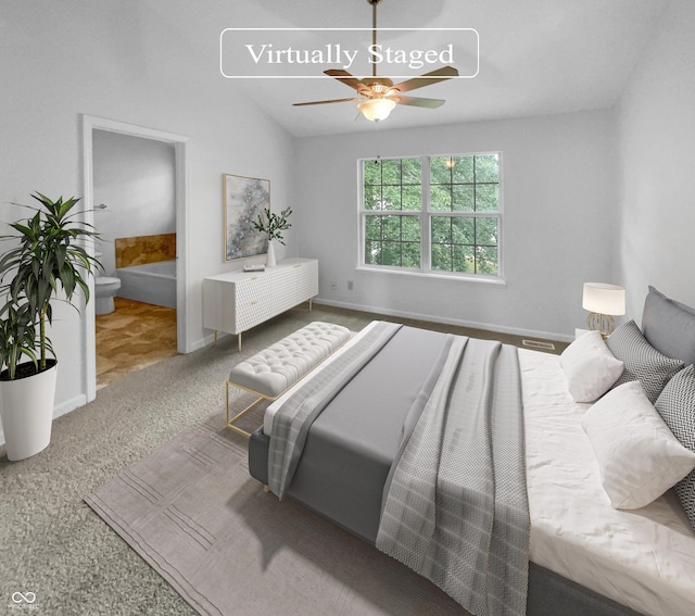 carpeted bedroom with ceiling fan and vaulted ceiling