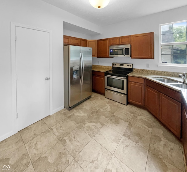 kitchen featuring appliances with stainless steel finishes and sink