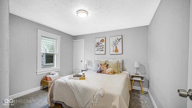 carpeted bedroom featuring wooden walls