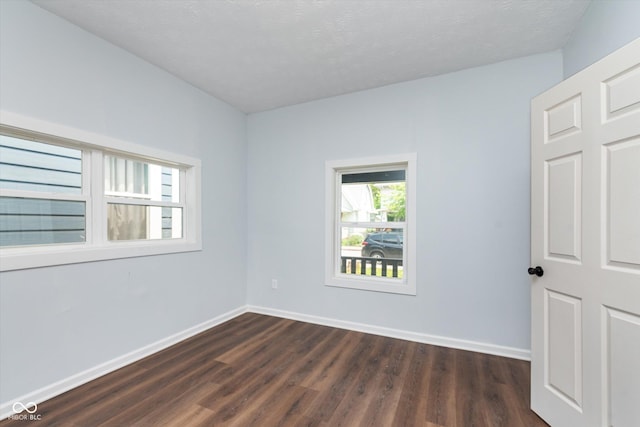 empty room featuring dark hardwood / wood-style floors