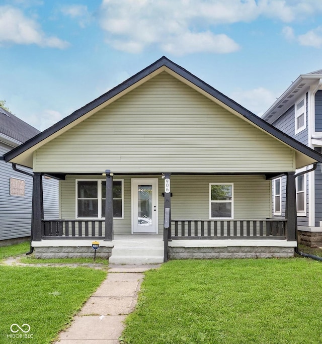 bungalow featuring a porch and a front yard