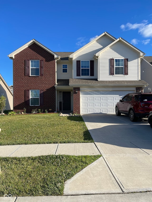 view of front property featuring a garage and a front lawn