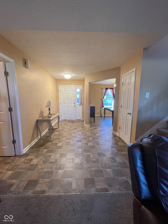 view of carpeted foyer