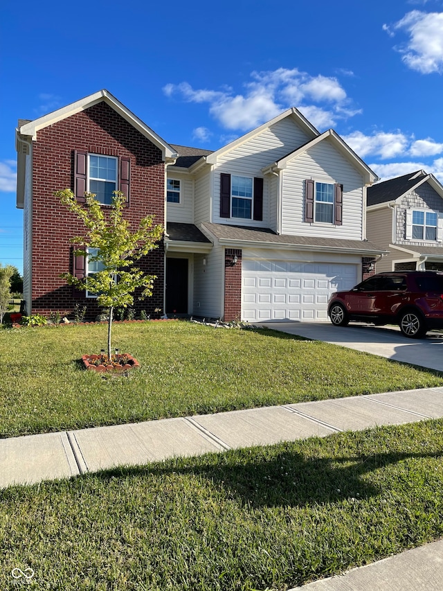 view of front property featuring a garage and a front yard