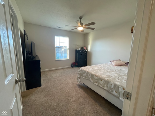 bedroom with light colored carpet and ceiling fan