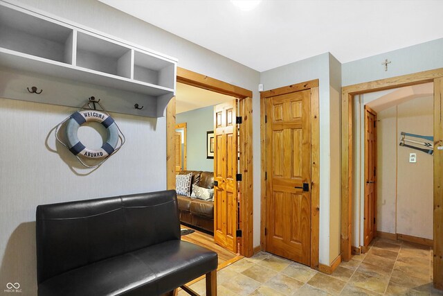 mudroom with light tile patterned floors