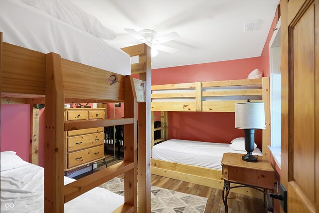 bedroom featuring ceiling fan and hardwood / wood-style flooring