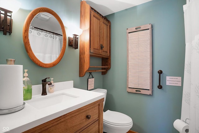 bathroom with vanity and toilet