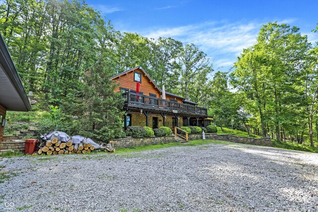 view of front of house with a wooden deck