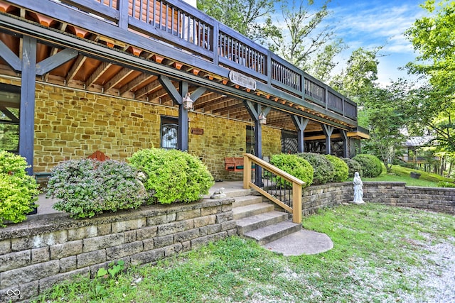 exterior space with a yard and a wooden deck