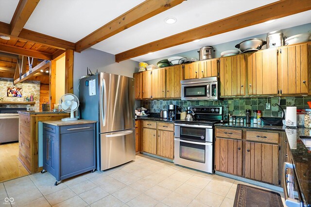 kitchen featuring light hardwood / wood-style floors, appliances with stainless steel finishes, decorative backsplash, and beamed ceiling