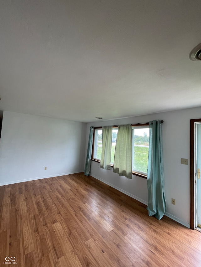 empty room featuring wood-type flooring