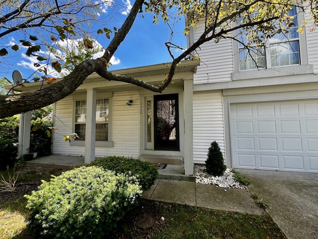 view of exterior entry with a garage