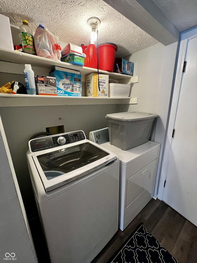 laundry room with dark hardwood / wood-style floors, a textured ceiling, and independent washer and dryer