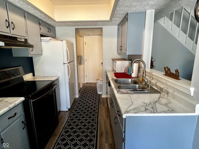 kitchen featuring a textured ceiling, electric range, dark hardwood / wood-style floors, and sink