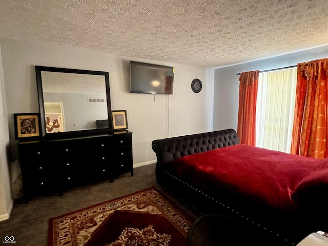 carpeted bedroom with a textured ceiling