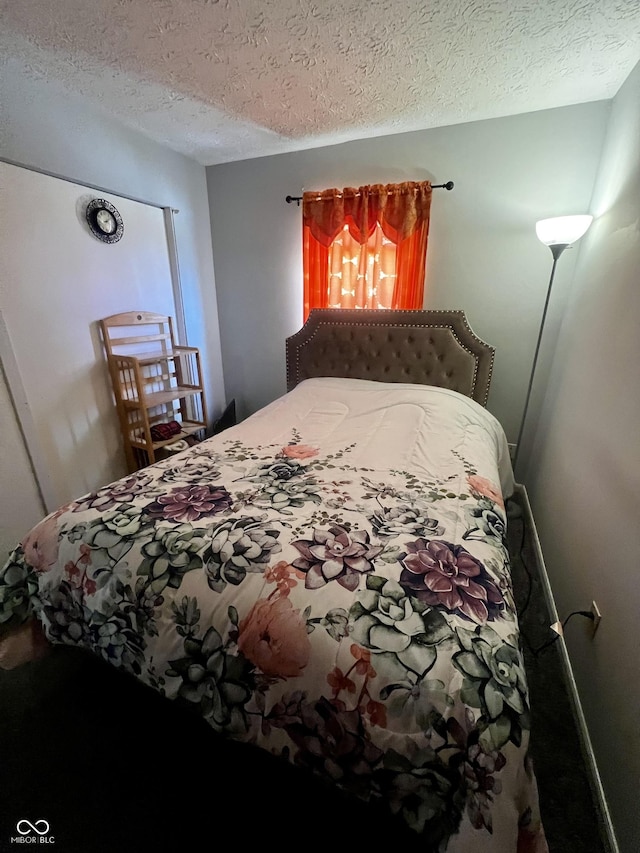 bedroom featuring a textured ceiling