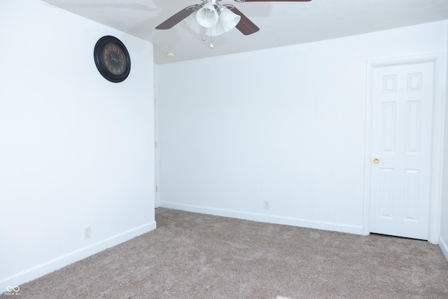 carpeted empty room featuring ceiling fan