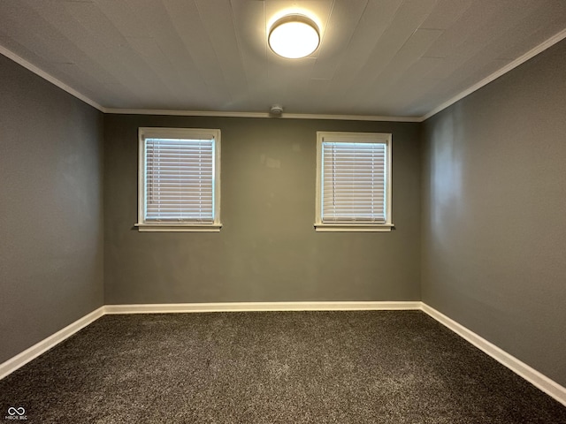 unfurnished room with crown molding and carpet