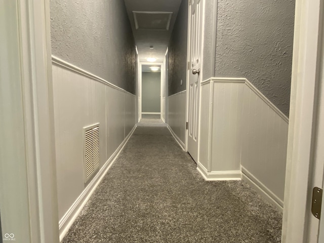 hall with dark carpet