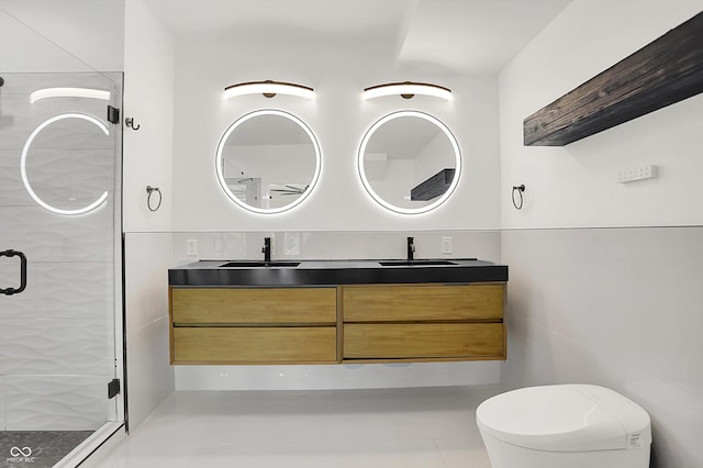 1218 Orange St, Indianapolis, IN 46203 - bathroom with double vanity, a shower stall, and toilet