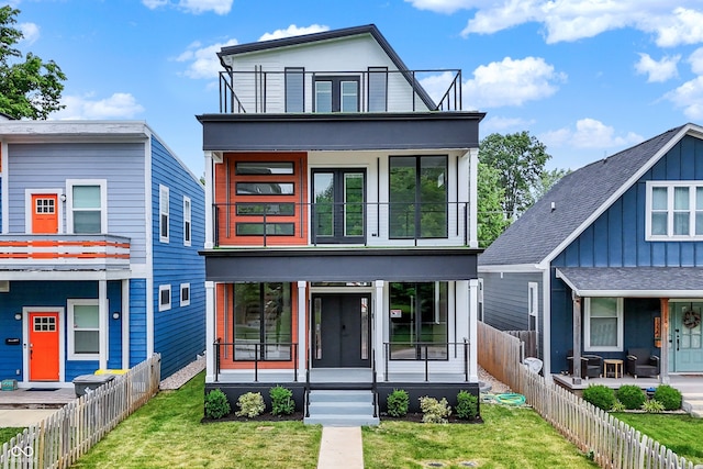 1218 Orange St, Indianapolis, IN 46203 - view of front of home featuring a balcony and covered porch
