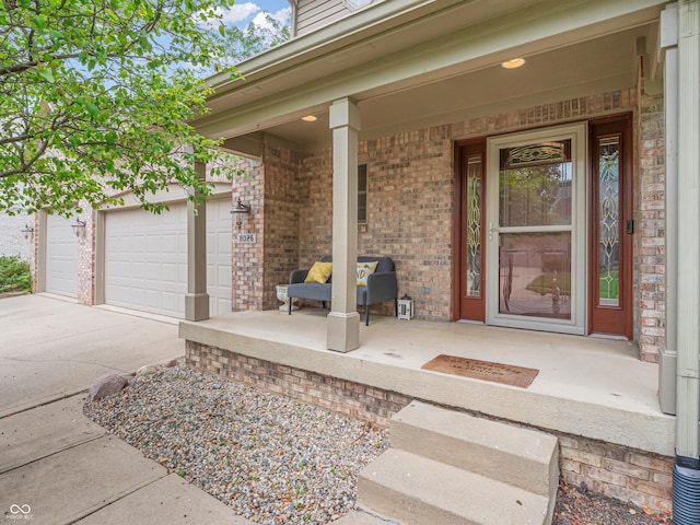 view of exterior entry featuring covered porch