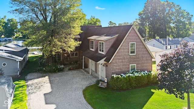 view of property exterior featuring a garage and a lawn