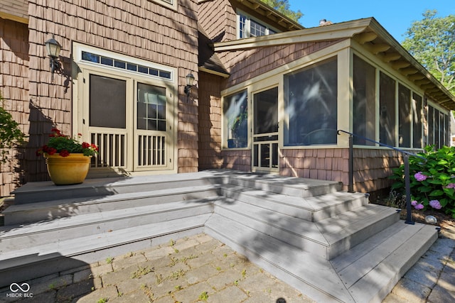 exterior space featuring a sunroom