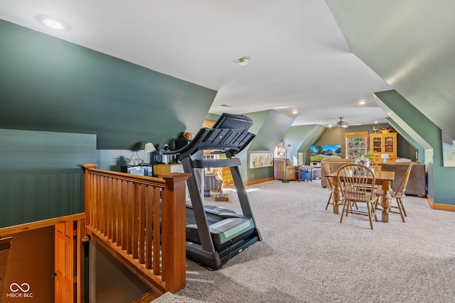 exercise area featuring vaulted ceiling and carpet