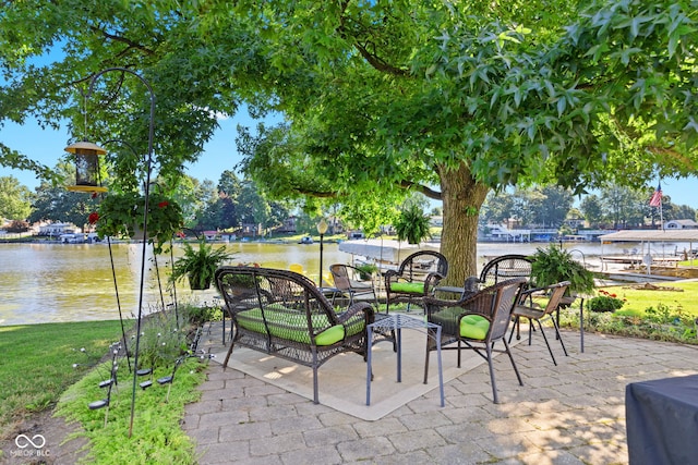 view of patio featuring a water view