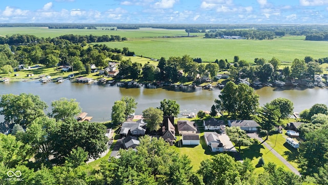 birds eye view of property featuring a water view and a rural view