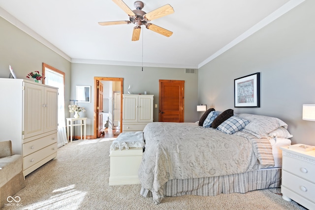 bedroom featuring light carpet, ornamental molding, and ceiling fan