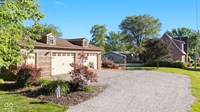 view of side of home with a yard and a garage