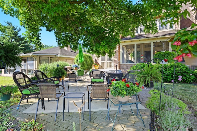 view of patio / terrace with a sunroom