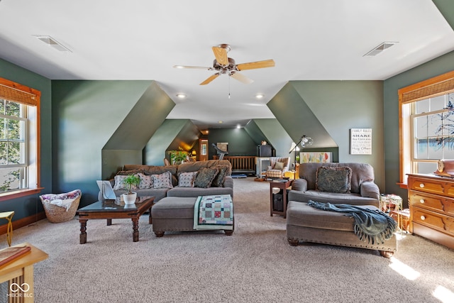 carpeted living room featuring lofted ceiling and ceiling fan